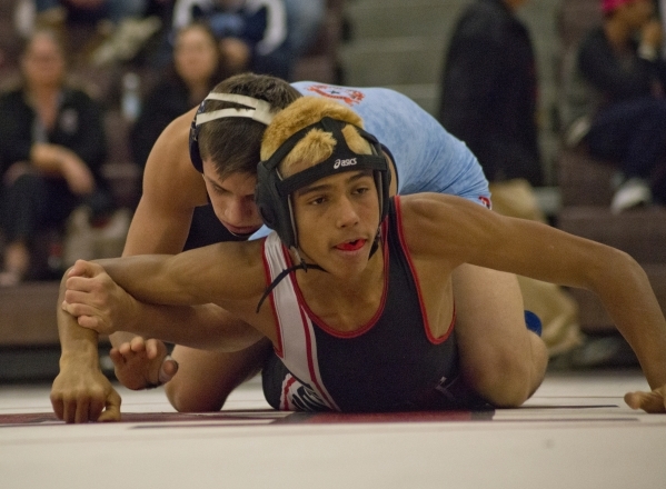 Centennial&lsquo;s Nico Antuna, top, wrestles Las Vegas&lsquo; Aaron Najera during a quad me ...