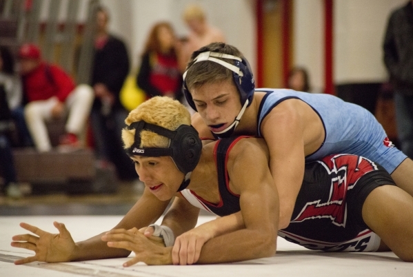 Centennial&lsquo;s Nico Antuna, top, wrestles Las Vegas&lsquo; Aaron Najera during a quad me ...