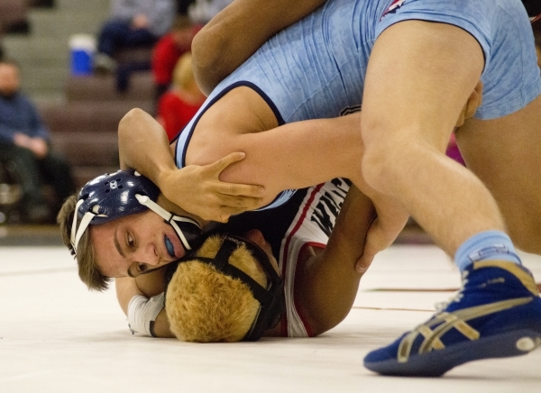 Centennial&lsquo;s Nico Antuna, top, wrestles Las Vegas&lsquo; Aaron Najera during a quad me ...