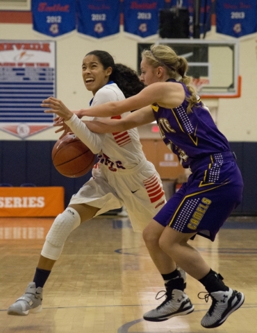 Bishop Gorman‘s Shaira Young (2) tries to get the ball past Shyann Russell (13) of the ...