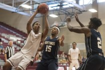 Aamondae Coleman (5) of Desert Oasis prepares to shoot against Shadow Ridge‘s Vernon S ...