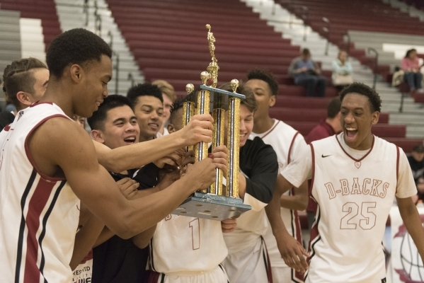 The boys from Desert Oasis High School celebrate winning the championship game of the Tri-St ...