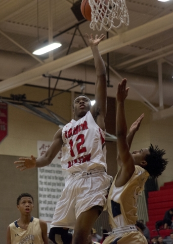 Arbor View‘s Corey Johnson (12) takes the ball to the basket during their home game ...