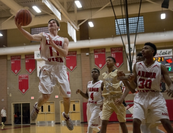Arbor View‘s Jesse Vogel (11) takes the ball to the basket during their home game agai ...