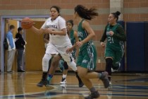 Foothill‘s Trinity Betoney (42) works the ball up the court during their home game aga ...