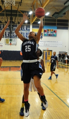 Centennial guard Samantha Thomas (25) goes up for a layup against Spring Valley in the first ...