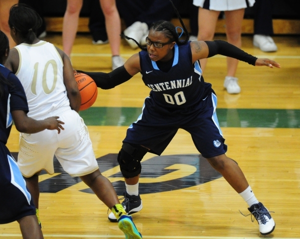 Centennial guard Tanjanae Wells (00) steals the ball from Spring Valley guard Shon Thompson ...