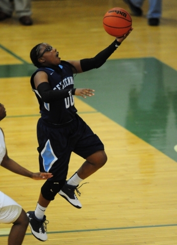 Centennial guard Tanjanae Wells (00) scores on a layup after stealing the ball from Spring V ...