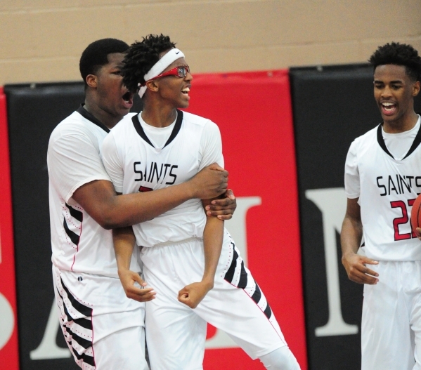 Mountain View Christian School‘s Terrence Brooks, middle, Micah Wheeler, left, and Tyr ...