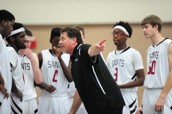 Mountain View Christian School head coach Raymond LeBoeuf instructs his team against Agassi ...