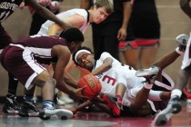 Agassi Prep forward Daniel Plummer, left, fights for a loose ball with Mountain View Christi ...