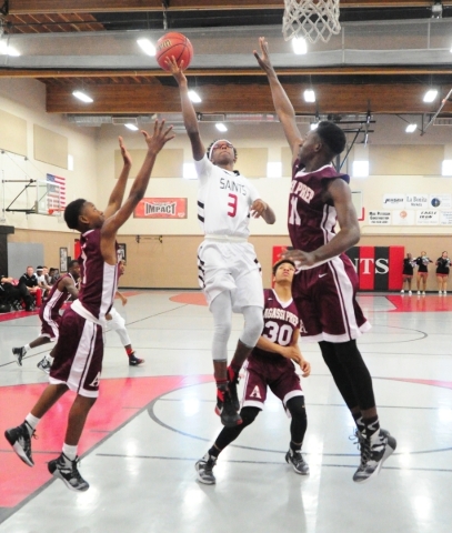 Mountain View Christian School guard Terrence Brooks goes up for shot against Agassi Prep fo ...