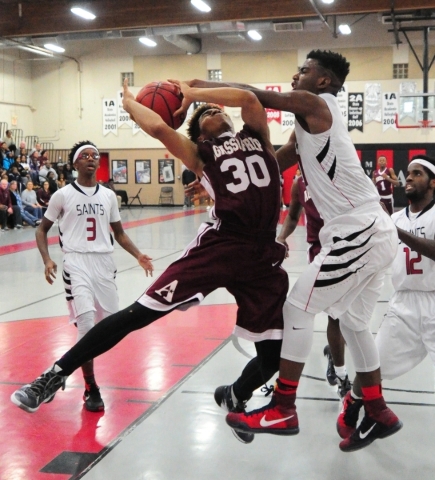 Mountain View Christian School guard Tevin Gray, right, blocks a shot from Agassi Prep guard ...