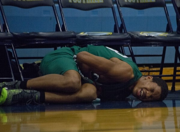 Rancho‘s Lamont Traylor (33) clutches his finger in pain after falling during their ga ...