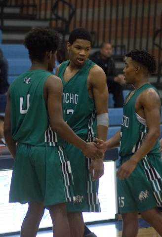 Rancho‘s Lamont Traylor (33), center, speaks with teammates during their game at Footh ...