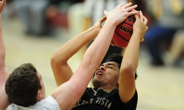 Faith Lutheran forward Zach Friel, left, fouls Sierra Vista forward Maui SeraJosef in the fi ...