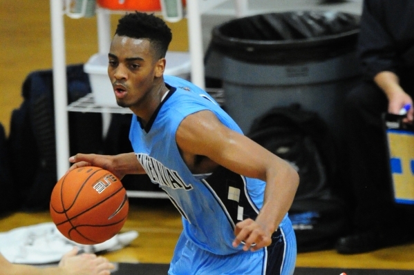 Centennial guard Troy Brown (0) drives to the basket against Durango in the fourth quarter o ...