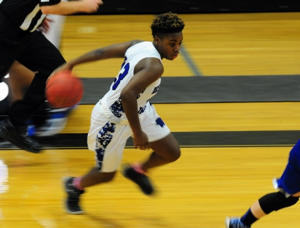 Desert Pines guard Jordan Bailey dribbles the ball up-court against Moapa Valley in the thir ...