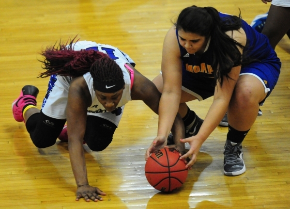 Desert Pines forward See‘Airrah Evans-Collins, left, and Moapa Valley center Kaila Eno ...