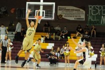Spring Valley guard Kayla Harris (11) intercepts a pass intended for Faith Lutheran guard Bo ...