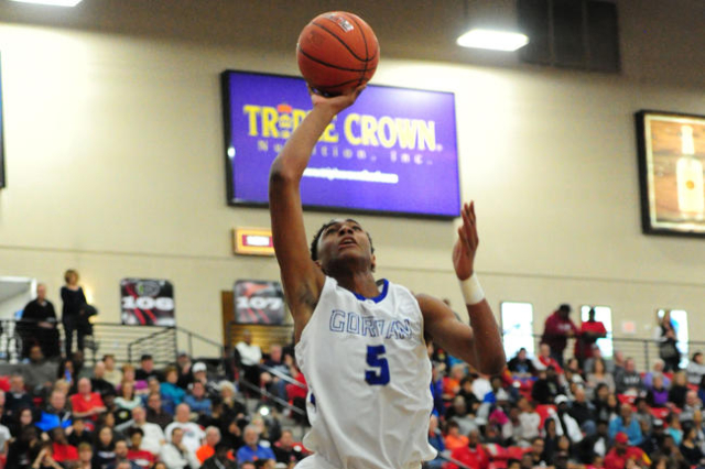 Bishop Gorman guard Chuck O‘Bannon Jr. (5) fouls Findlay Prep guard Shakwon Barrett (2 ...