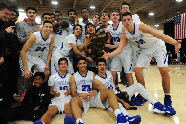 Bishop Gorman players celebrate their 77-71 upset win over Findlay Prep during their prep ba ...