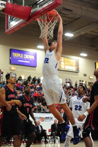 Bishop Gorman forward Zach Collins (12) dunks against Findlay Prep in the second quarter of ...