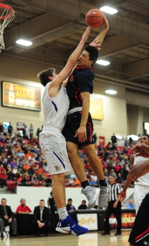Findlay Prep guard Skylar Mays, right, is fouled by Bishop Gorman forward Byron Frohnen whil ...