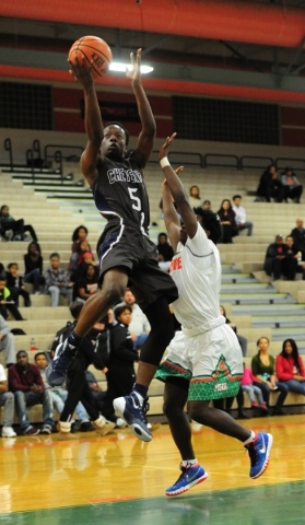 Cheyenne guard Kavon Williams (5) goes up for a shot against Mojave guard Tyrique Watson in ...