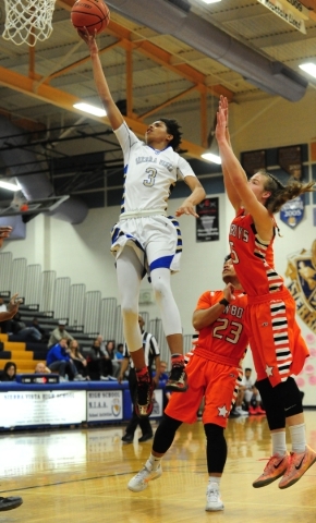 Sierra Vista guard Tanner Lewis (3) goes up for a shot against Chaparral guard Ben Kirschbau ...