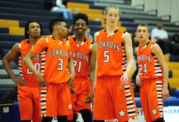 Chaparral players are seen during an injury time out in the third quarter of their prep bask ...
