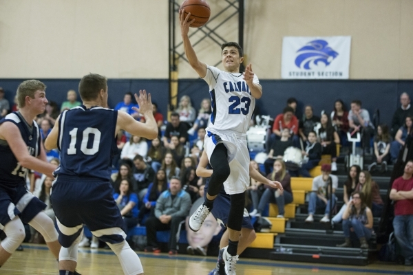 Calvary Chapel‘s Cameron Varela (23) goes up for a shot in the boy‘s basketball ...