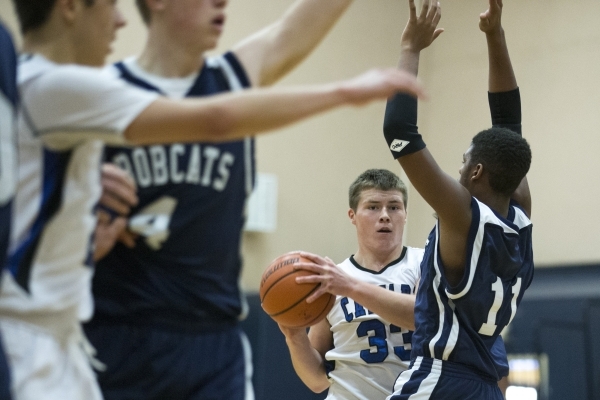 Calvary Chapel‘s James Gentile (33) looks for an open pass in the boy‘s basketba ...
