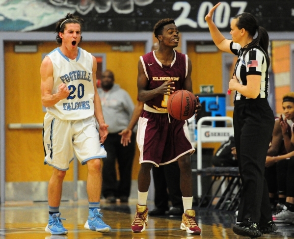 Eldorado guard Carl Crayon (1) reacts after being called for traveling while Foothill guard ...