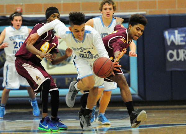 Foothill guard Marvin Coleman II, center, steals the ball away from Eldorado forward Shane B ...