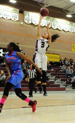 Faith Lutheran guard Maddie Bocobo (3) goes up for a shot against Western guard Capricia Pie ...