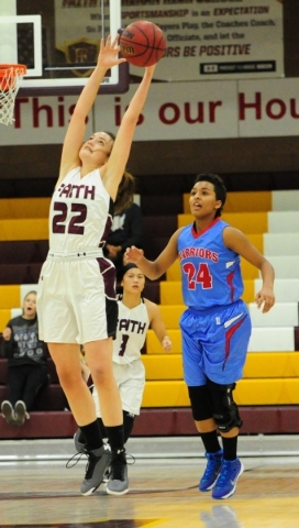 Faith Lutheran Emily Kirvin (22) attempts to catch a pass in front of Western guard Jennessa ...