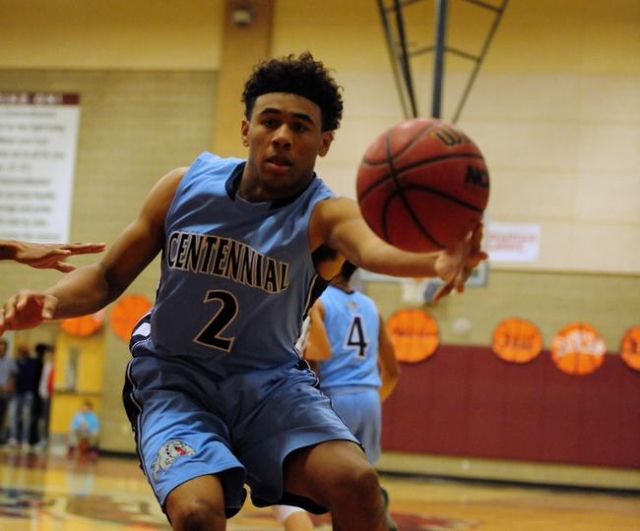 Centennial forward Jamaal Evans catches a pass in the fourth quarter of their prep basketbal ...