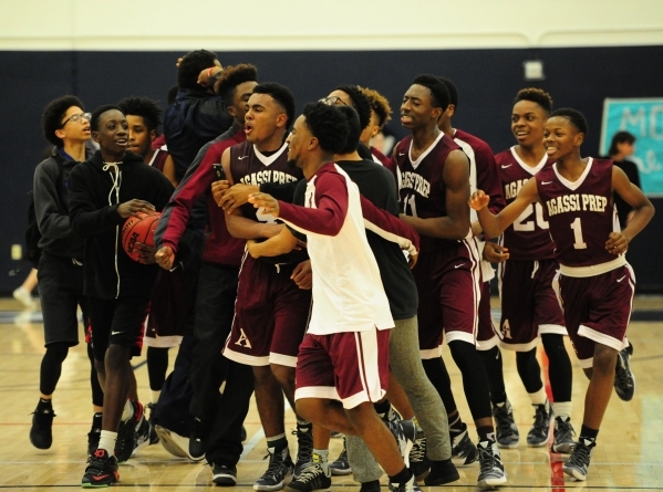 Agassi Prep forward Daniel Plummer (4) and teammates celebrate their 60-59 victory over The ...