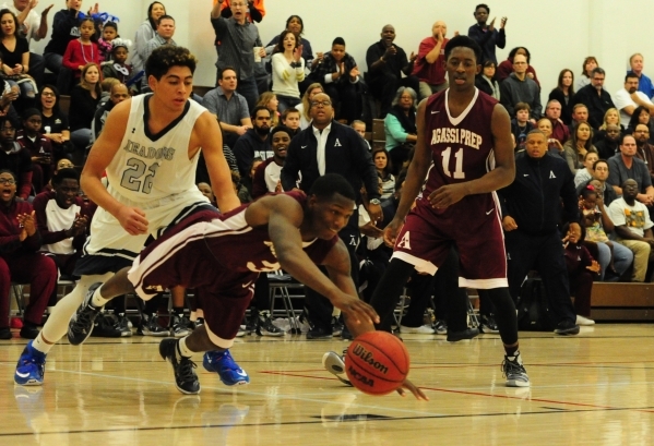 Agassi Prep guard Stephan Laushaul (3) dives for a loose ball in front of The Meadows center ...