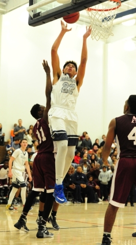 The Meadows center Max Hisatake (22) goes up for a shot against Agassi Prep forward Jared Ho ...