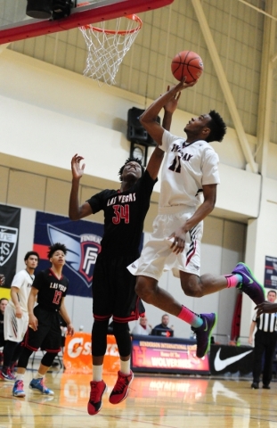 Findlay Prep guard Oshae Brissett (11) goes up for a shot against Las Vegas wing Marquise Ra ...
