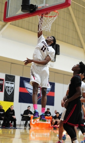 Findlay Prep guard Oshae Brissett (11) dunks against Las Vegas in the first quarter of their ...