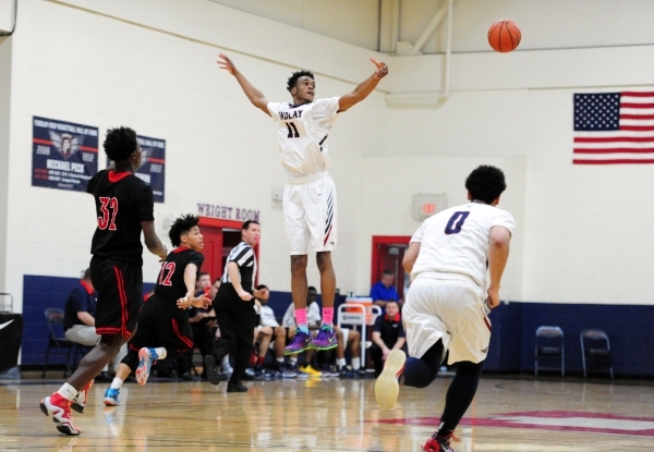 Findlay Prep guard Oshae Brissett attempts to intercept Las Vegas guard Dartanion Myers&lsqu ...