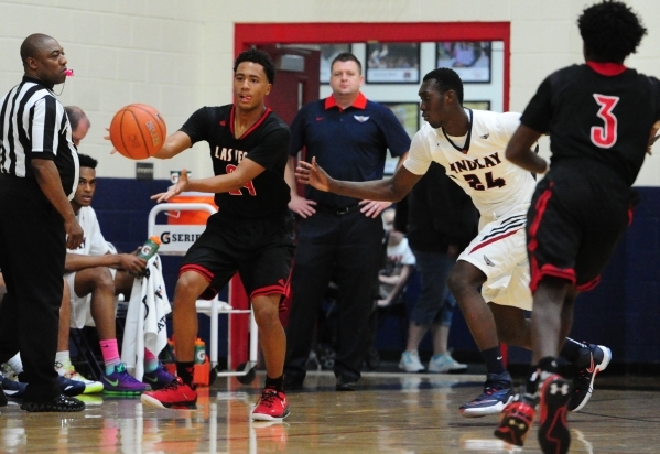 Las Vegas guard Zach Matlock, left, catches a pass while Findlay Prep guard Lamine Diane (24 ...