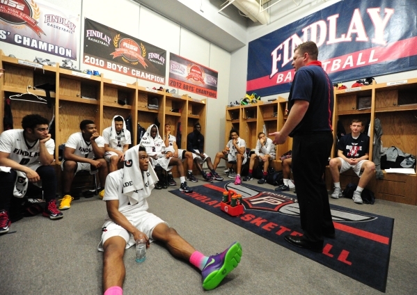 Findlay Prep head coach Andy Johnson addresses his team during halftime of their prep basket ...