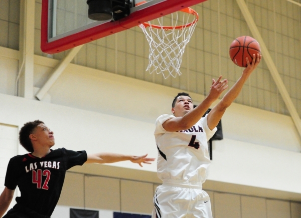 Findlay Prep guard Skylar Mays (4) goes up for as shot agaisnt Las Vegas guard Jason Cullen ...