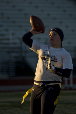 Boulder City quarterback Jeanne Carmell (14) throws the ball up the field during their game ...
