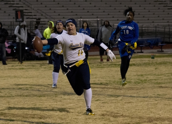 Boulder City quarterback Jeanne Carmell (14) extends the ball for a touchdown during their g ...