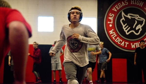 Antonio Saldate runs across the mat during practice inside the wrestling room at Las Vegas H ...